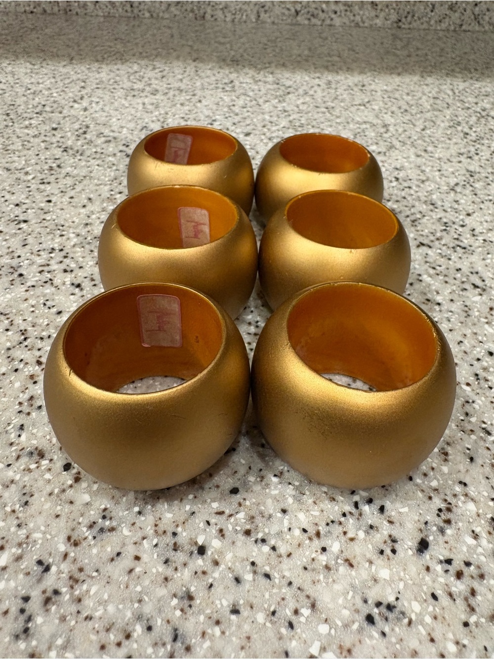 Set Of 6 round, barrel-shaped metallic gold napkin rings